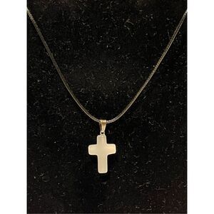 White Stone Cross on a Black Necklace Cord